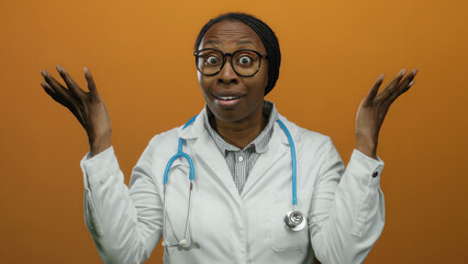 Woman doctor wearing white coat and stethoscope with expressive face against orange background,...