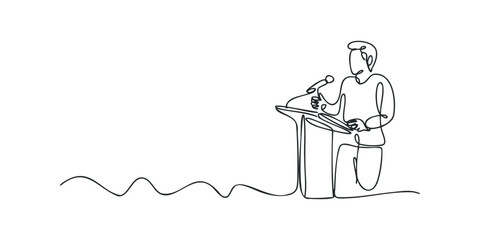 Person speaking at a podium with a microphone