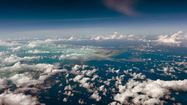 wide angle, 4k aerial video footage, flying along East and South Caicos as part of Turks and Caicos Islands a British Overseas Territory in Atlantic Ocean  - partly covered with clouds