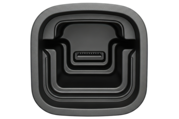 Empty black plastic charging cradle with a connector port inside on a transparent background