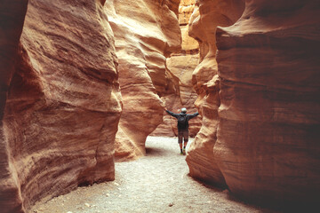 Young man walking in Red Canyon in the Negev Desert near Eilat, Israel