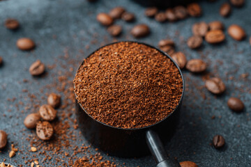 Ground coffee in scoop closeup