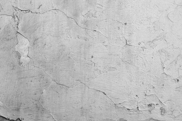 Black and white cracked wall with peeling paint for vintage building and distressed surface concept