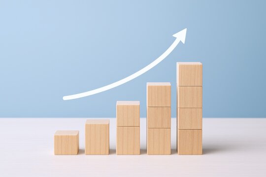 Growth Chart Made of Wooden Blocks Showing Business Success and Upward Trend on Blue Background