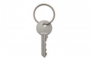 Silver house key on metal keyring, representing access, security, and ownership with transparent background