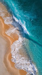 Obraz premium Aerial View Turquoise Waves Crashing on Sandy Beach, White Foam Textures, Summer Coastline Vibe