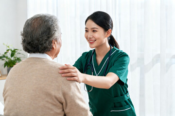 Nurse assisting elderly person