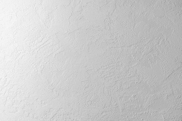 Textured white wall with subtle patterns ideal for backgrounds or displays