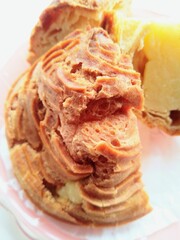 Cream Puff Pastry With Custard Filling On Pink Plate, Fresh Baked Dessert Treat