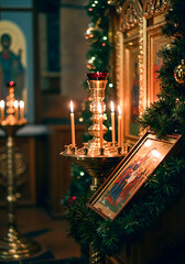 Orthodox altar with candles and religious icon in church setting  