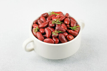 Red kidney beans  in white bowl for vegan, healthy eating or rustic food concept