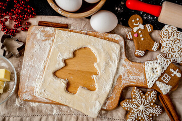 cooking christmas gingerbread on wooden background top view