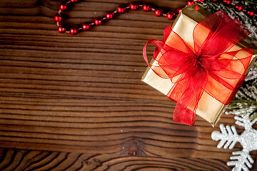packaging christmas gifts in boxes on wooden background top view