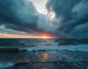 Dramatic Baltic Sea sunset during approaching storm aerial view. Dark clouds gather above ocean waves reflecting orange light. Powerful sea creates moody atmosphere, conveys raw nature beauty.