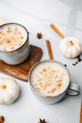 Cozy autumn drinks with cinnamon and pumpkins, warm beverages ready to enjoy