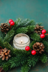 Pine cone wreath candle winter drink festive holiday celebration warm cozy atmosphere cozy Christmas eve celebration