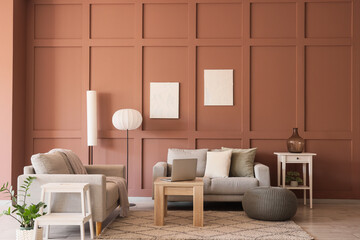 Interior of stylish living room with grey sofas, standard lamps and laptop on coffee table
