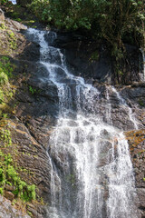 Valanjanganam Waterfalls, Kuttikkanam, Kerala: Scenic cascade tumbling over rocks in lush forest, popular roadside destination for travellers in Idukki, South India, natural beauty and tranquillity