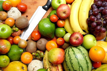 Before cut Fresh fruits rich in antioxidants and nutrients. knife and cutting board.