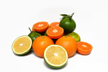 Fresh orange, lime, citrus fruits on white background