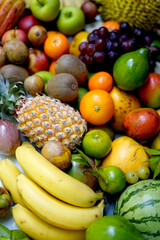 Fresh tropical fruits assortment on white background.
