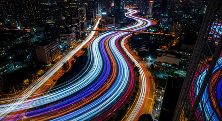 Cityscape at Night with Colorful Traffic Light Streaks, Urban Nightscape with Car Light Trails in a Busy City Center
