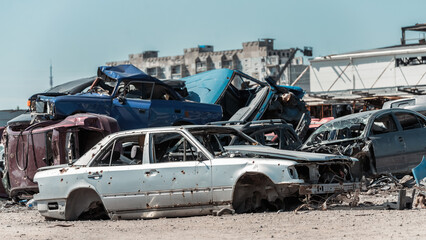 destroyed and burned cars in the city of Kiev during the war in Ukraine