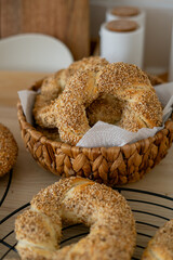 Hot homemade Turkish simit in the kitchen. Bagels with sesame seeds. Pastries.