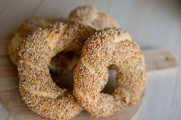 Hot homemade Turkish simit in the kitchen. Bagels with sesame seeds. Pastries.