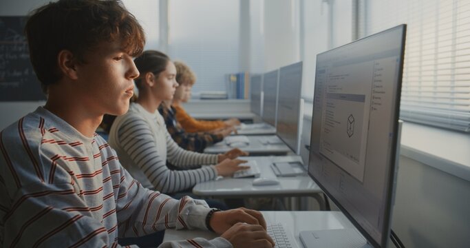 University Students Sit at Computers in Well Lit Classroom Opposite Window, Writing Program Code. Concept of Group Learning, Collaboration, Software Development, and Digital Education. Dolly Shot.
