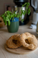 Hot homemade Turkish simit in the kitchen. Bagels with sesame seeds. Pastries.