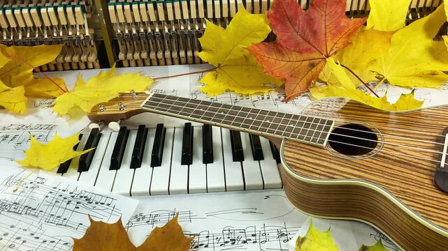 Acoustic Autumn Duet: A beautiful wooden ukulele rests on the keys of an old upright piano, surrounded by golden maple leaves and handwritten sheet music, creating a warm and nostalgic atmosphere