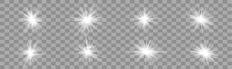 Bright twinkling stars and shining light beams burst with radiant glow on a vector transparent background. Magical sparkles shimmer softly with elegant illumination. Perfect for holiday cards and over