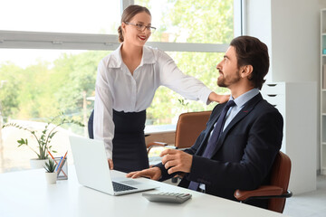 Sexy young secretary seducing her boss in office