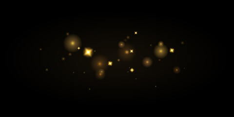 Golden sparks and stars on a transparent background. Magical glow, golden dust and shiny Christmas bokeh effect.