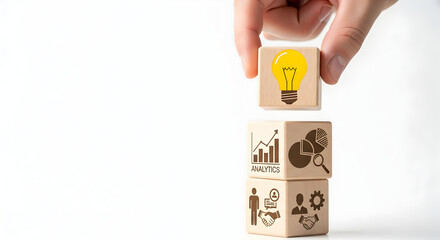 Hand stacks wooden cubes symbolizing business growth, idea generation, and successful collaboration, visualizing strategic planning and innovation.