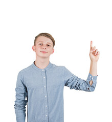 Contented male teenager pointing up his forefinger as looks confident to camera. Positive...
