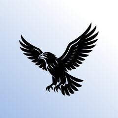 Silhouette of flying eagle with spread wings on blue gradient background