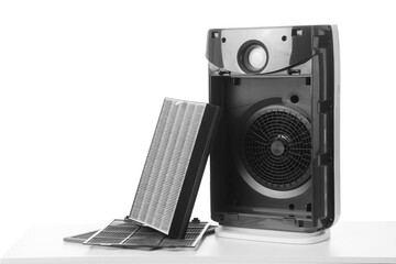 Obraz premium Disassembled air purifier with dirty filter isolated on white background