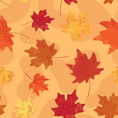 Colorful maple leaves in red orange and yellow scattered on a warm beige seamless background in flat style. Ideal for fall themed packaging web and fabric