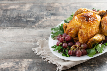 Roast turkey with grapes and parsley for thanksgiving dinner. Copy space