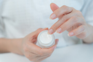 Good skin woman use cream for good skin. face of a healthy woman apply cream and makeup. Advertisement for skin cream, anti-wrinkle, baby face, whitening, moisturizer