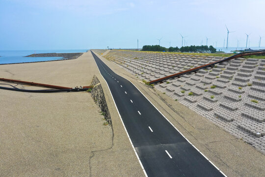 New construction from the  Dike Road (Dutch: Afsluitdijk) is a 32-kilometer-long dam between the IJsselmeer and the North Sea in the Netherlands. Aerial view, Drone photography.