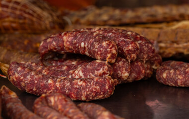 Freshly prepared homemade sausages displayed on rustic wooden table