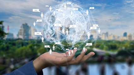Global communication network concept Hand supporting a digital globe with icons of people and chat bubbles symbolizing social media connection worldwide conversation and digital technology integration