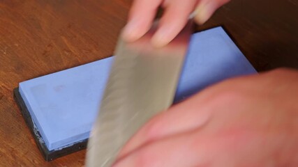 This demonstration shows how to sharpen a knife with a whetstone for optimal blade maintenance and care