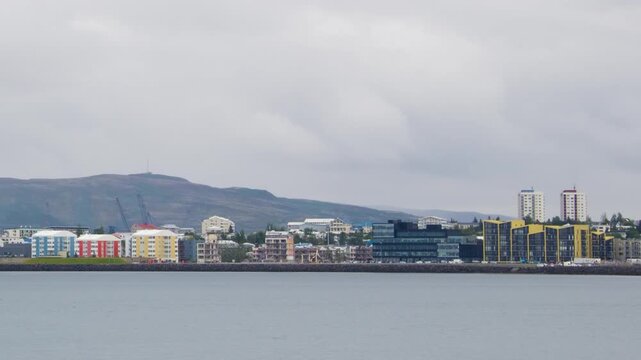 Reykjavik, Iceland. View of the Reykjavik, Iceland skyline during a cloudy summer day. Time-lapse