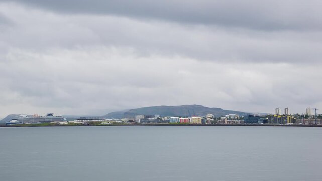 Reykjavik, Iceland. View of the Reykjavik, Iceland skyline during a cloudy summer day. Time-lapse