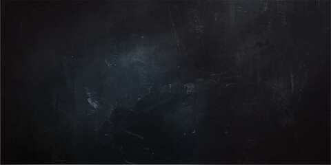 Dark abstract grunge background with chalk texture on a blackboard surface for a vintage empty design space.