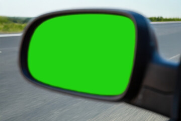 Car side mirror with green screen driving on road